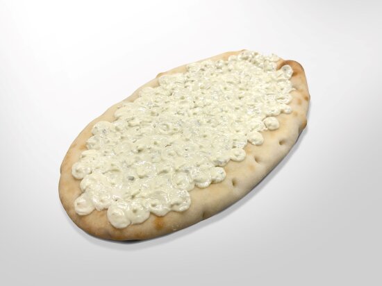 Oval flatbread with garlic butter deposited in closely spaced dots across the surface